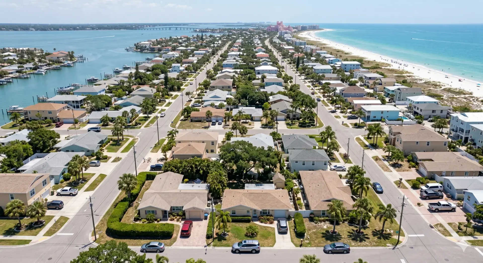 Drone view of coastal houses and beach, a prime location for Tile Installation St. Pete Beach.