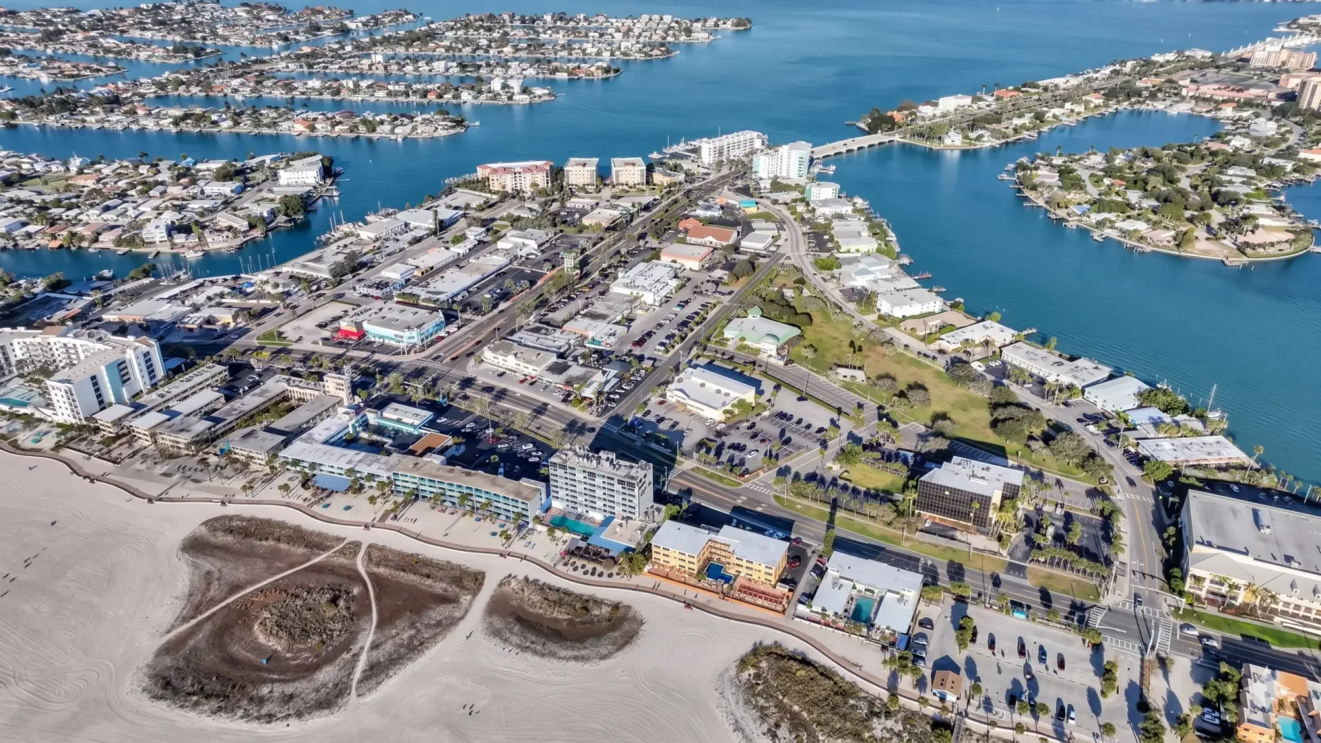 Aerial view of a coastal town highlighting properties that benefit from premium tile installation Treasure Island.