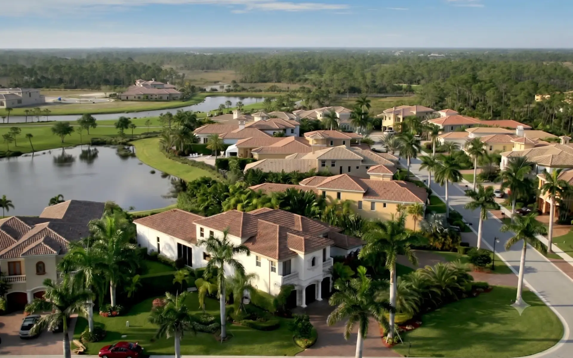 Aerial view of an upscale Lutz community where houses display beautiful roofs and professional Tile Installation Lutz services.