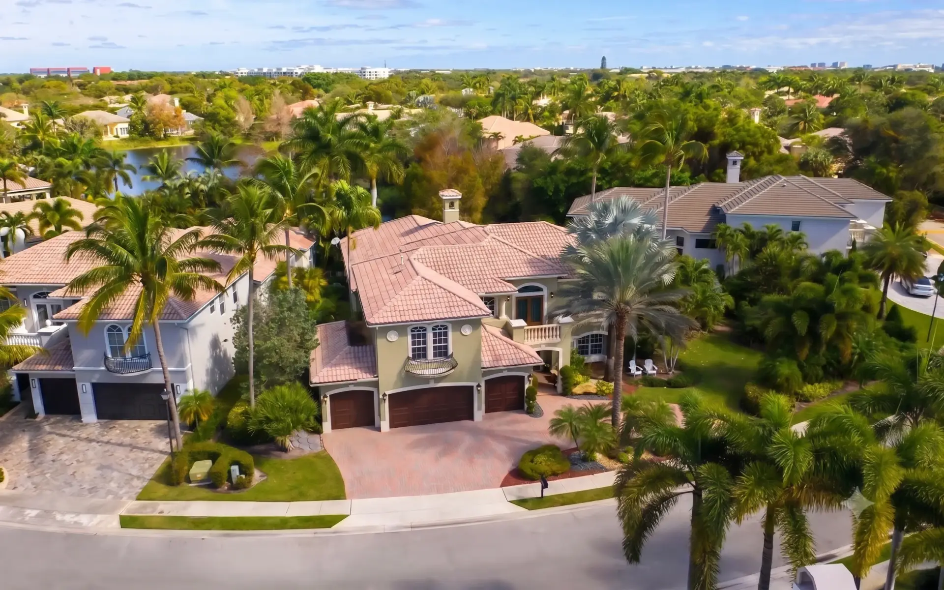Aerial view of upscale suburban houses with barrel roofs highlighting professional Tile Installation Odessa.